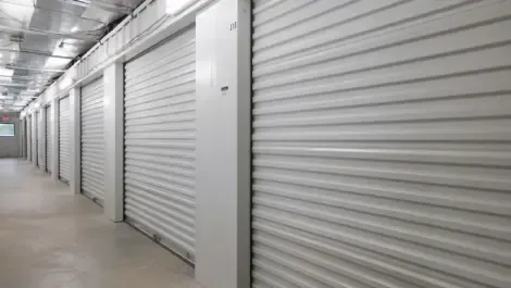 Interior row of indoor storage units with metal roll-up doors