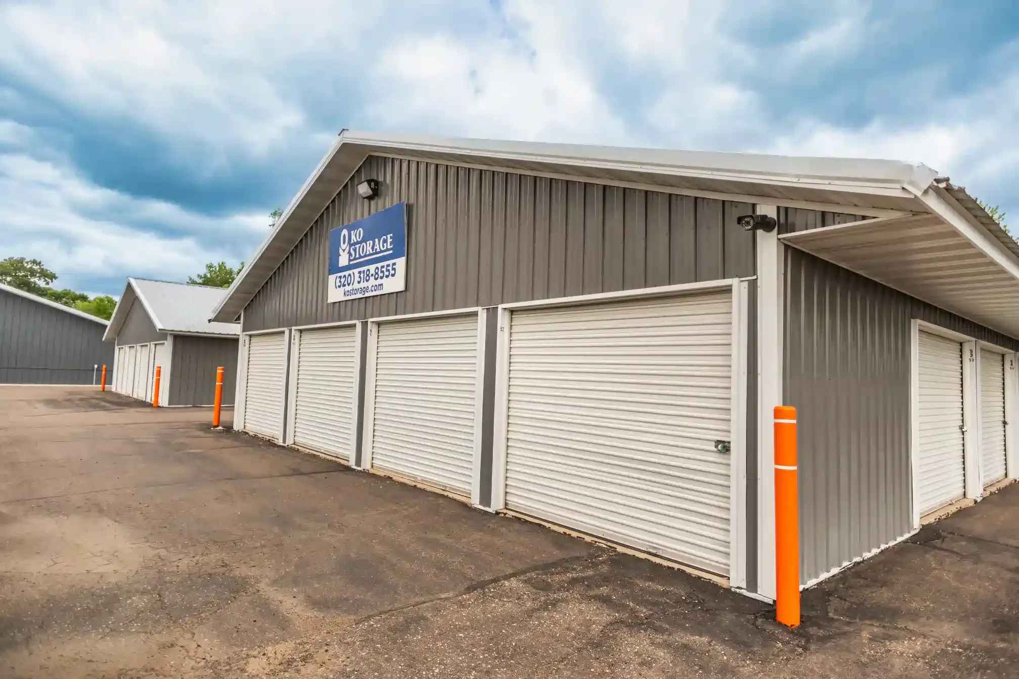 Four storage units and a sign.