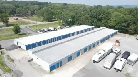 Aerial view of a self-storage facility showing multiple outdoor units and drive-up lanes
