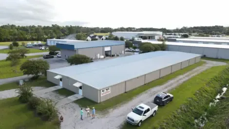 Aerial view of a self-storage facility showing multiple drive-up units