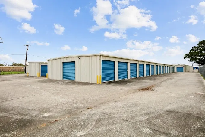 Mulitple storage units at the end of a building.