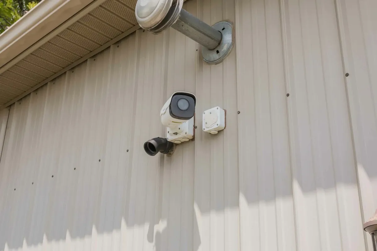 A security camera on a unit building.
