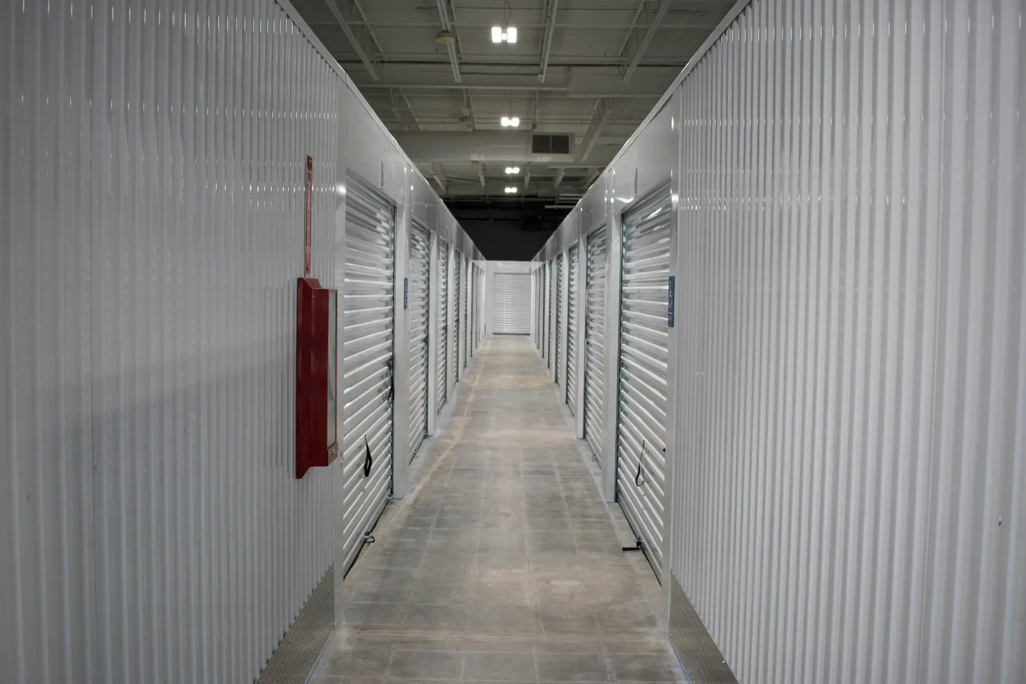 A long hallway of storage units.