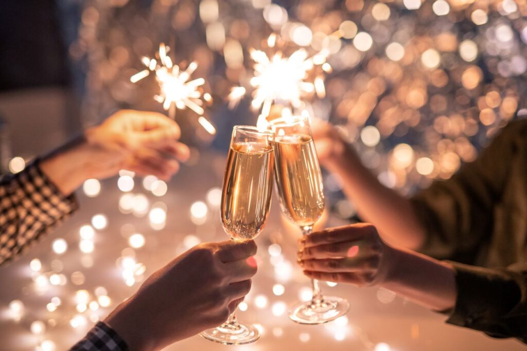 A group of friends toasts their champagne on New Year’s Eve.