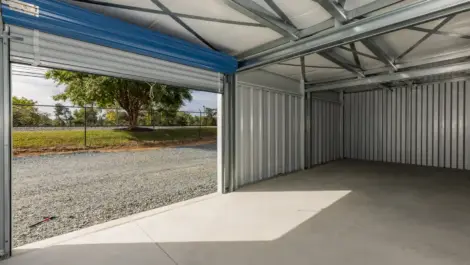 Interior of a storage unit with open space and bright lighting.