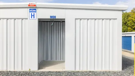 Interior view of a storage unit with empty space and concrete floor.