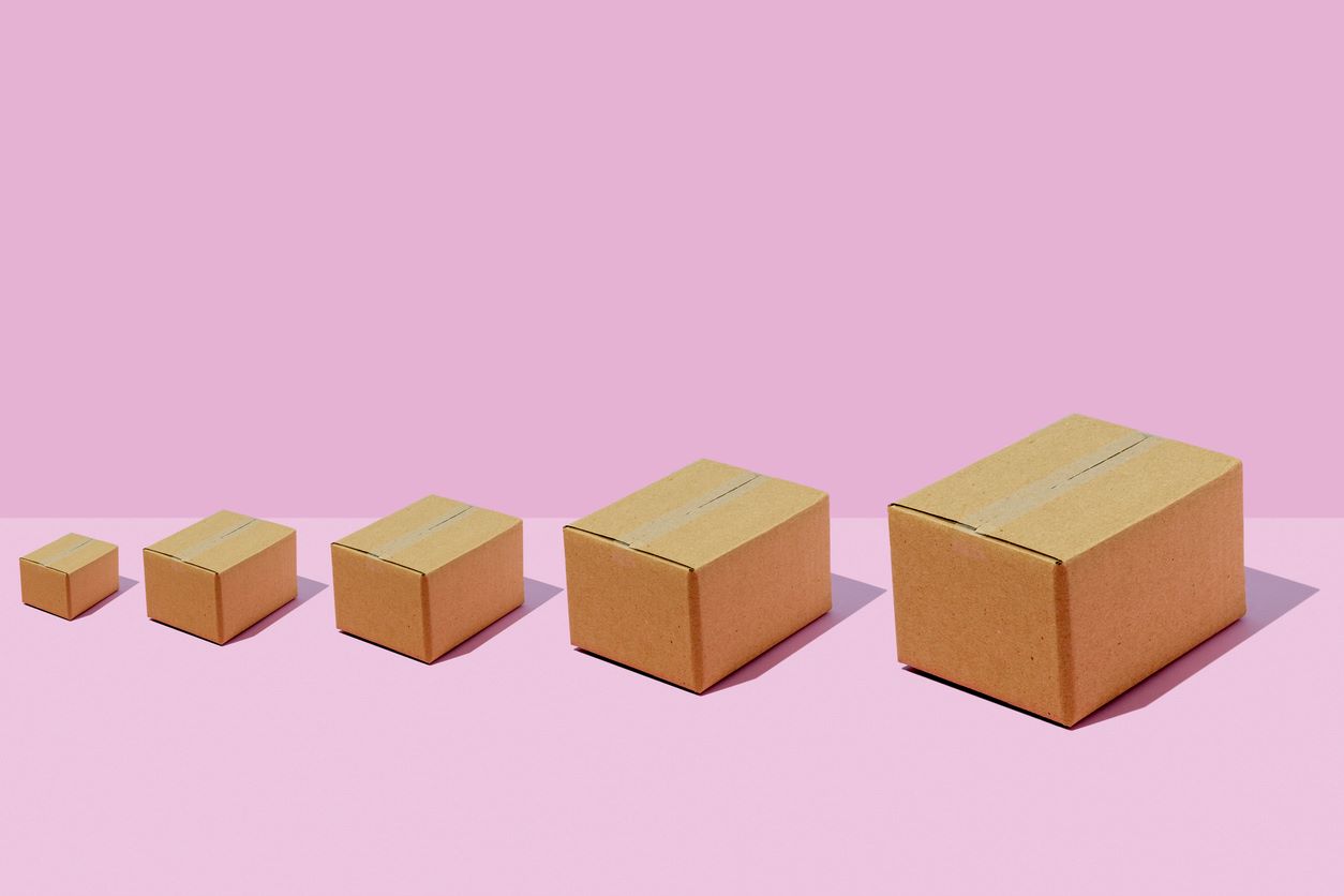 A row of different-sized cardboard boxes